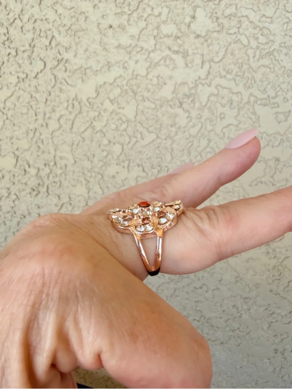 Intricate Rose Gold Floral Statement Ring with Orange Center Stone